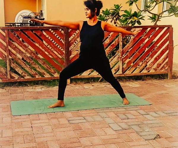 PRENATAL YOGA WARRIOR 2 Image of a pregnant lady practicing warrior 2